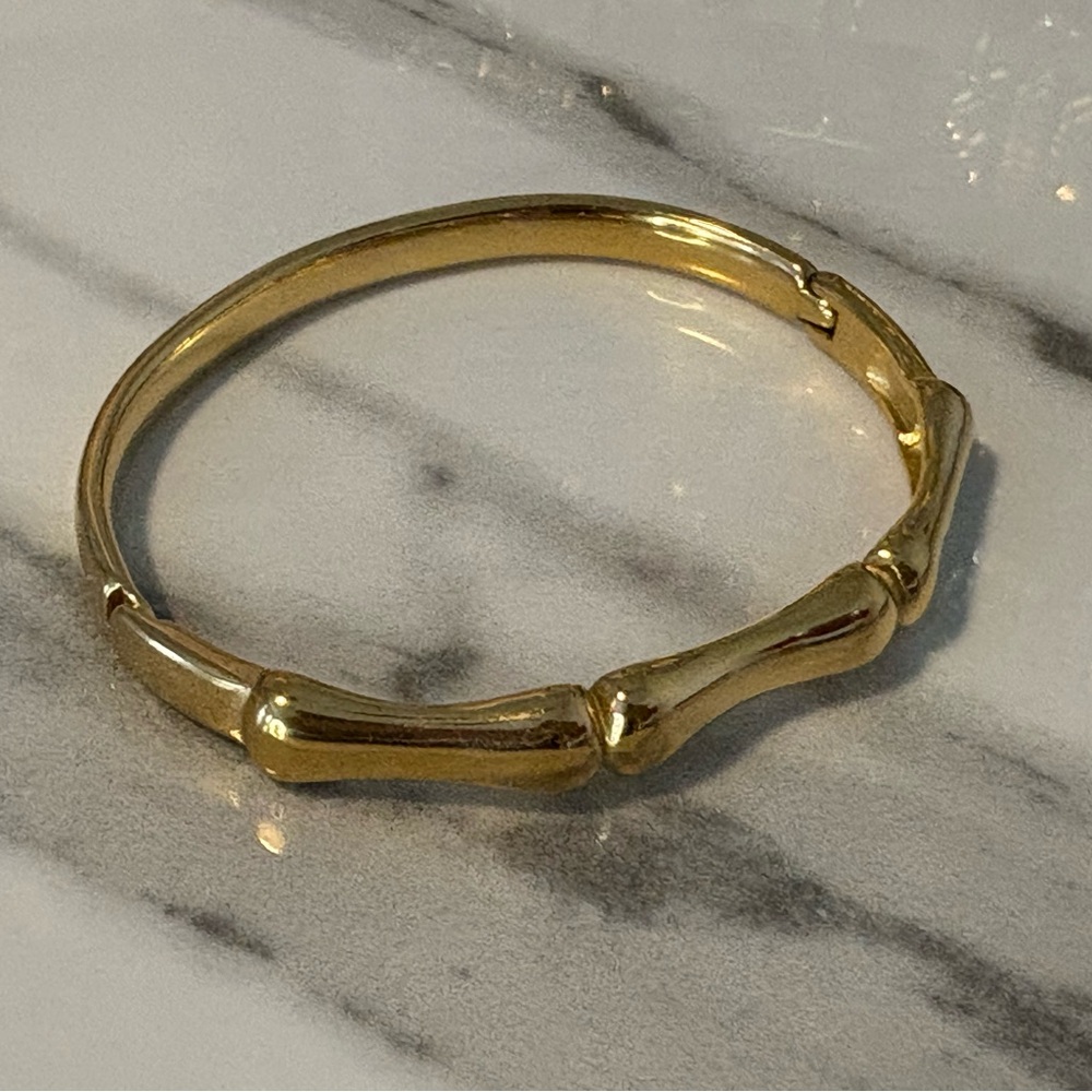 Gold Tone Bamboo Bangle. 7 1-2” opens on side